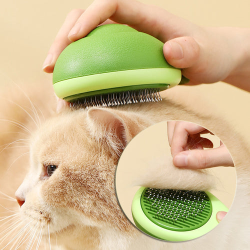 Green pet grooming brush being used on a cat with a beige background