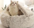 Fluffy pet bed with a cat inside.