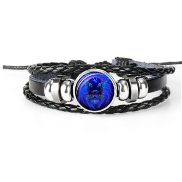 Multistrand bracelet with a blue circular pendant on a white background