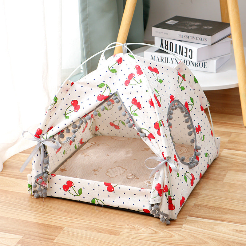 Pet tent with cherry pattern on a wooden floor