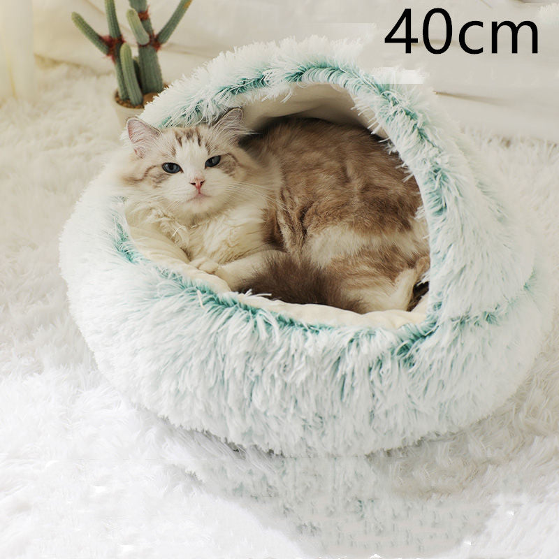 Cat lying in a fluffy white pet bed with green trim, size 40cm indicated.