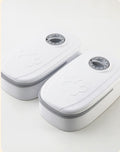 Two white electronic devices with gray accents on a light gray background