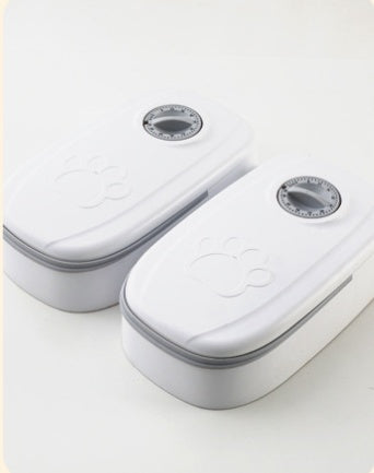 Two white electronic devices with gray accents on a light gray background