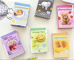 Collection of colorful children's books with various designs on a white surface.