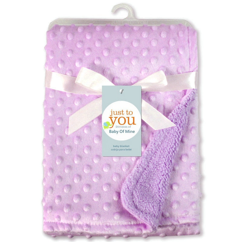 Purple polka dot baby blanket with a white bow and 'just to you' tag on a white background