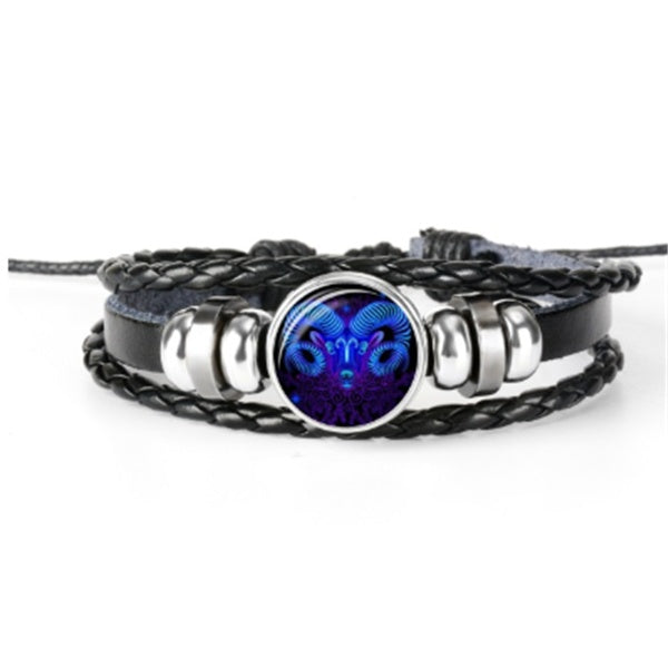Bracelet with black braided design and silver accents featuring a blue and purple gemstone on a white background.