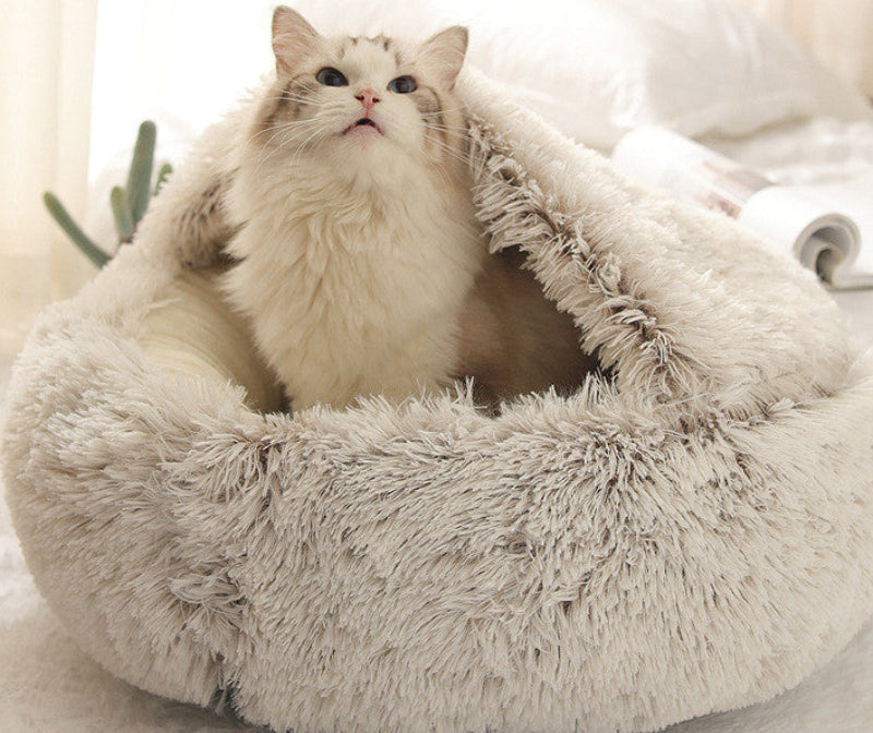 Fluffy pet bed with a cat inside