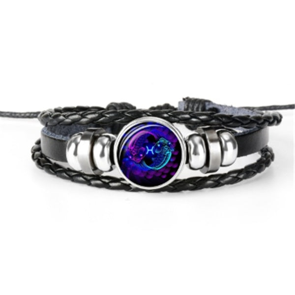 Multistrand bracelet with a colorful gemstone on a white background