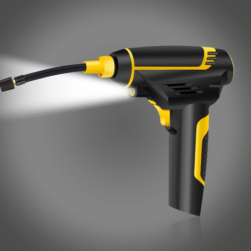 Black and yellow pressure washer gun on a gray background