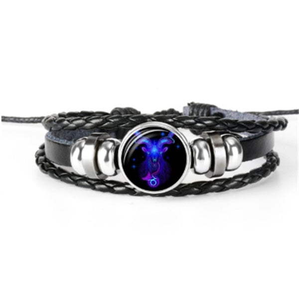 Bracelet with a dark blue and purple pendant on a white background