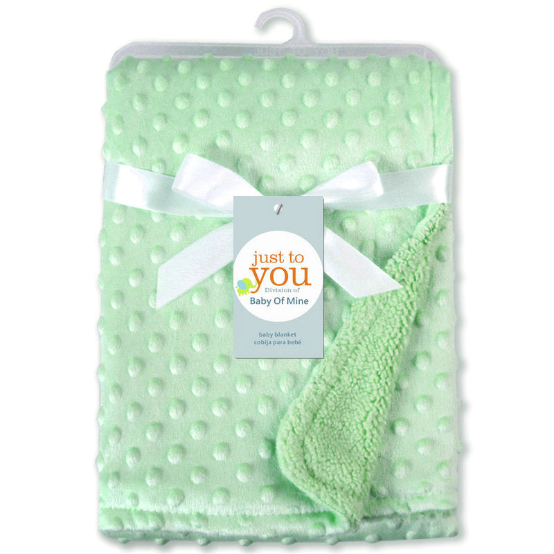 Green baby blanket with white polka dots and a white bow, branded 'just to you'.