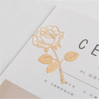 Gold rose design on a white background