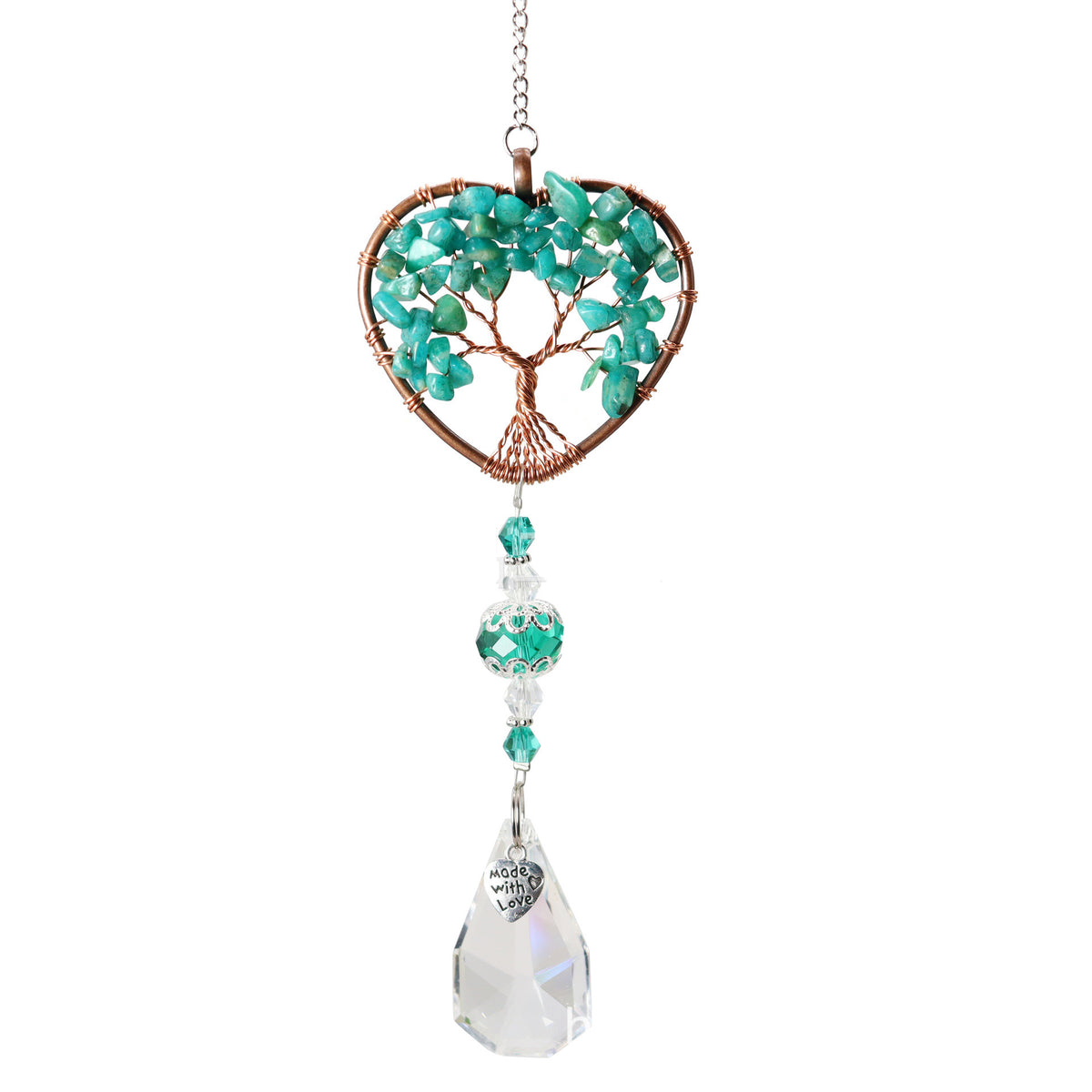 Decorative hanging heart with tree of life design and crystals on a white background