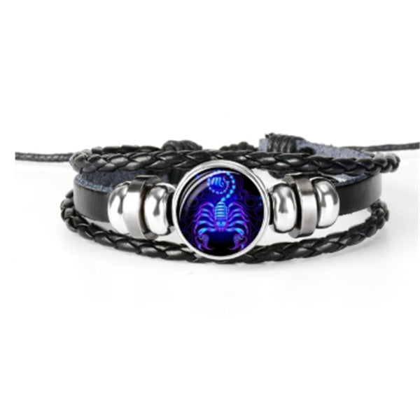 Multistrand bracelet with a scorpion pendant on a white background