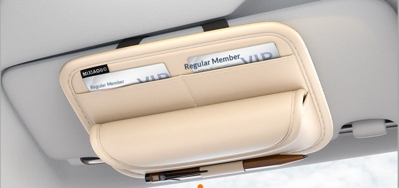 Car sun visor with a sunshade and an eye icon graphic, indicating safe driving.