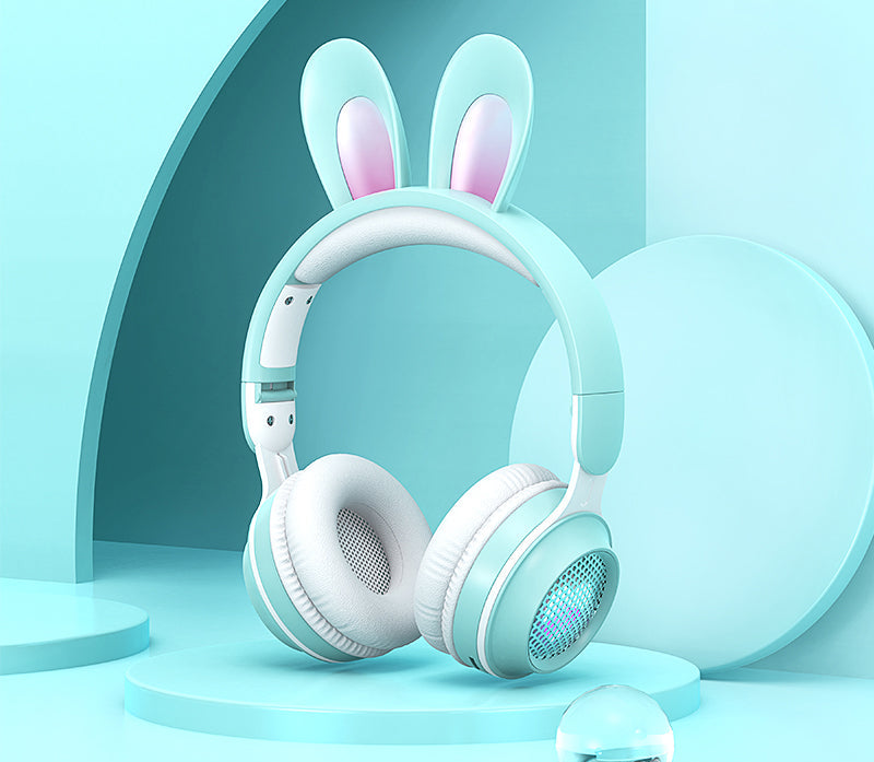 Mint green headphones with bunny ears on a light blue background