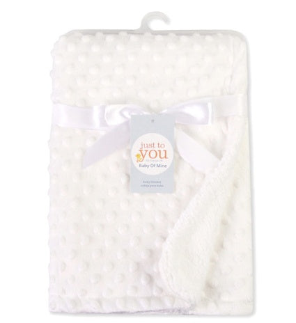 White baby blanket with 'just to you' label on a white background