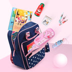 Navy blue backpack with pink accents filled with school supplies on a pink background