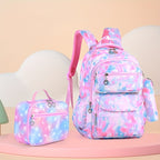 A pastel tie-dye school bag set featuring a large backpack and a matching small lunch bag, both decorated with a pink, blue, and white star pattern, set against a soft peach and cream background.