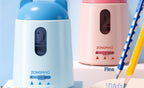 Two ZONGMAO automatic pencil sharpener devices shown side by side on a white pedestal against a light blue background. The left sharpener is light blue, and the right one is pink, both with cat-ear-shaped tops.