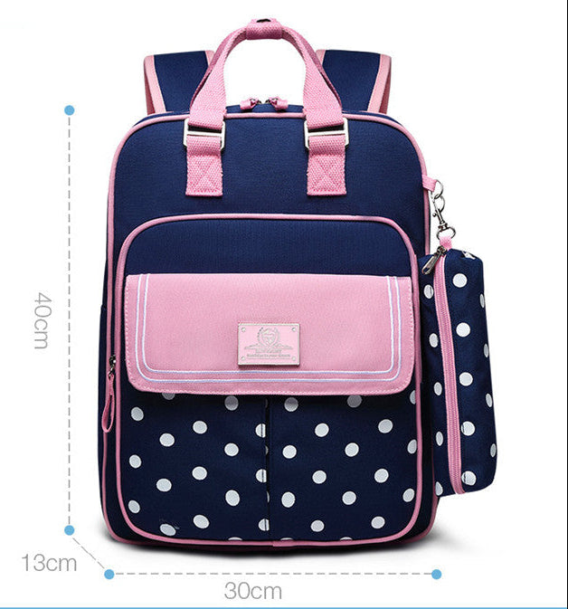 Navy blue and pink backpack with polka dot design and measurements on a white background