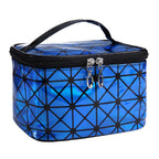 Blue geometric patterned cosmetic bag with black accents on a white background