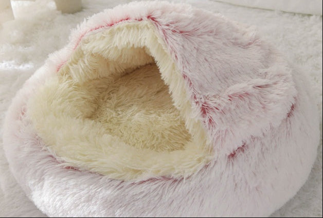 Fluffy white pet bed on a light gray background