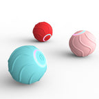 Three colorful balls (red, pink, and blue) on a white background