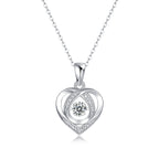 Silver heart-shaped pendant with a diamond on a white background
