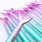 Mermaid tail straws with pink and blue gradient on a white background
