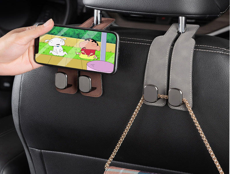 Car seat hooks double as a phone holder.