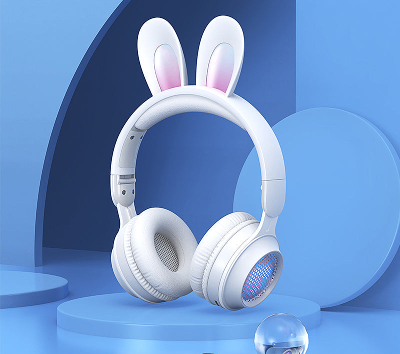 White headphones with bunny ears on a blue background