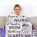 Woman wrapped in a blanket with 'I am a nurse and a mom, nothing scares me' text on a couch.