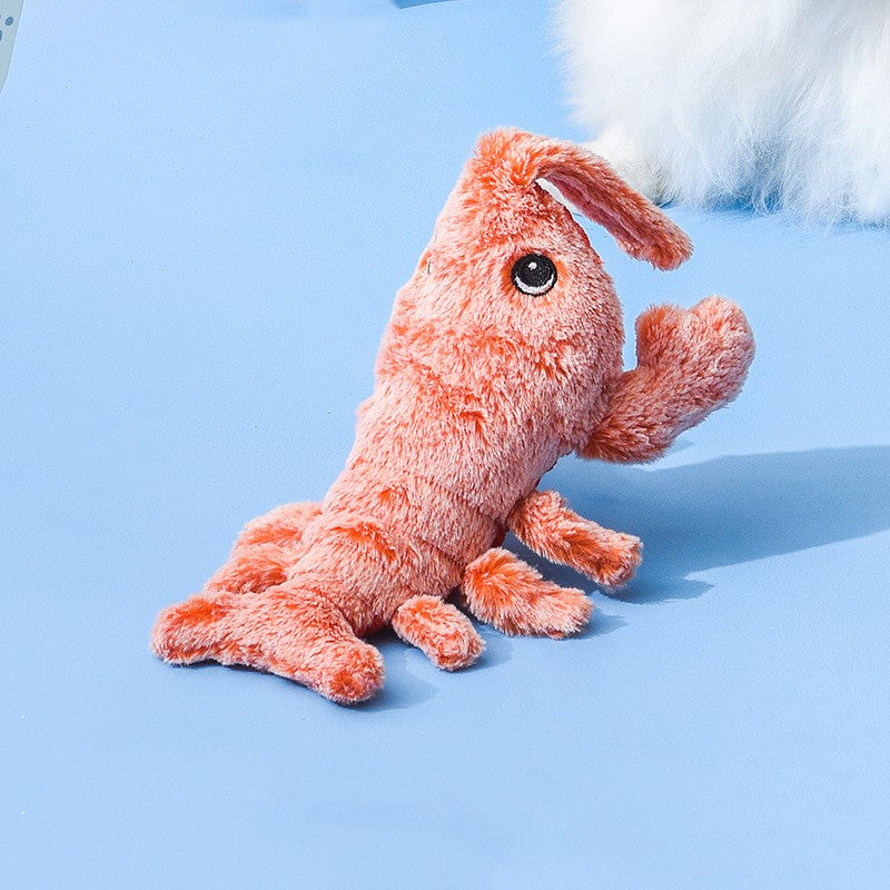 Plush toy resembling a shrimp blue background