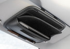 Car sun visor organizer with phone holder and pen tray, mounted on a car's sun visor.