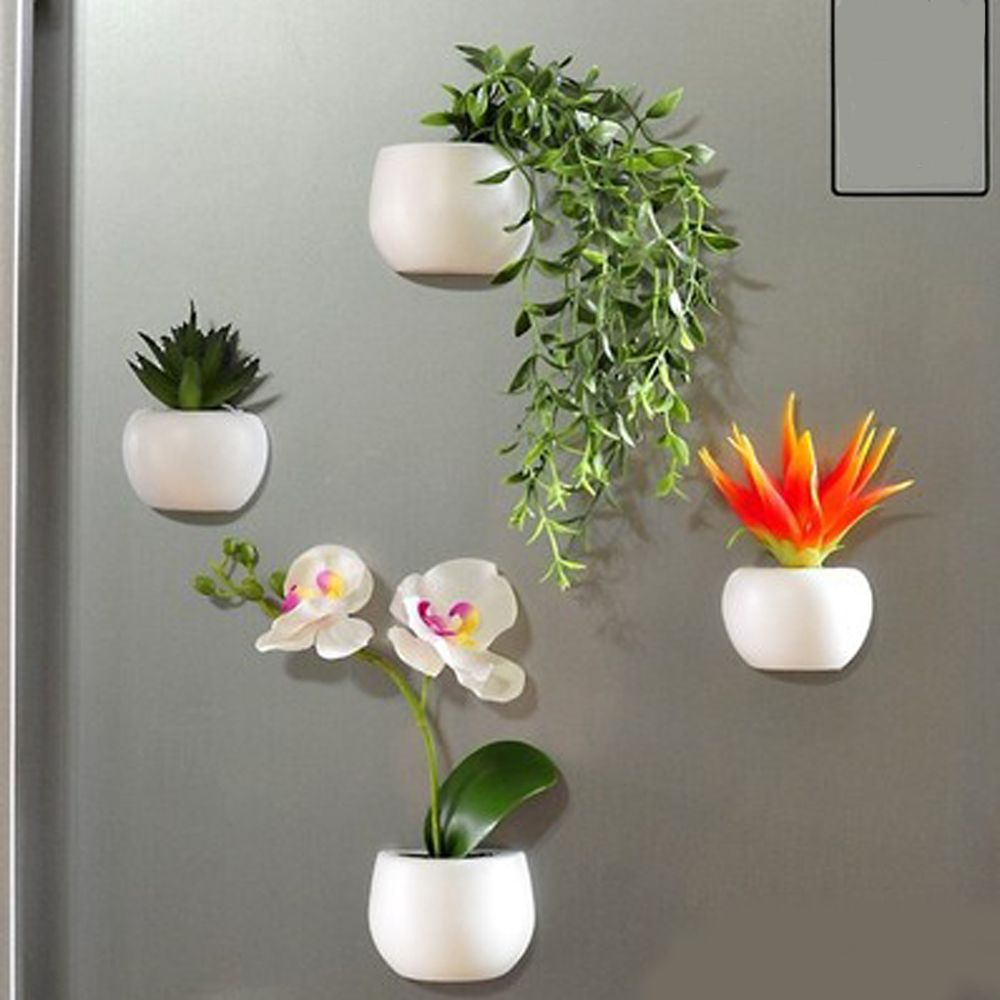 Fridge magnets shaped like plants on a refrigerator