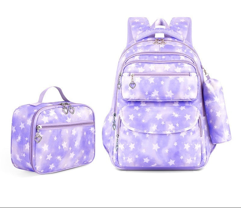 Purple backpack and smaller bag with star pattern on a white background