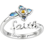 Silver ring with 'faith all things are possible' engraving and colorful gemstone design.