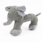 Knitted dog toy with a textured pattern on a white background