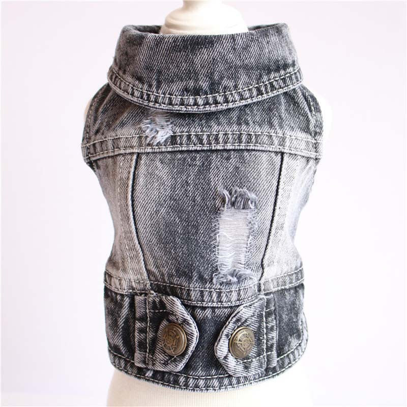 Denim vest with distressed details on a white background