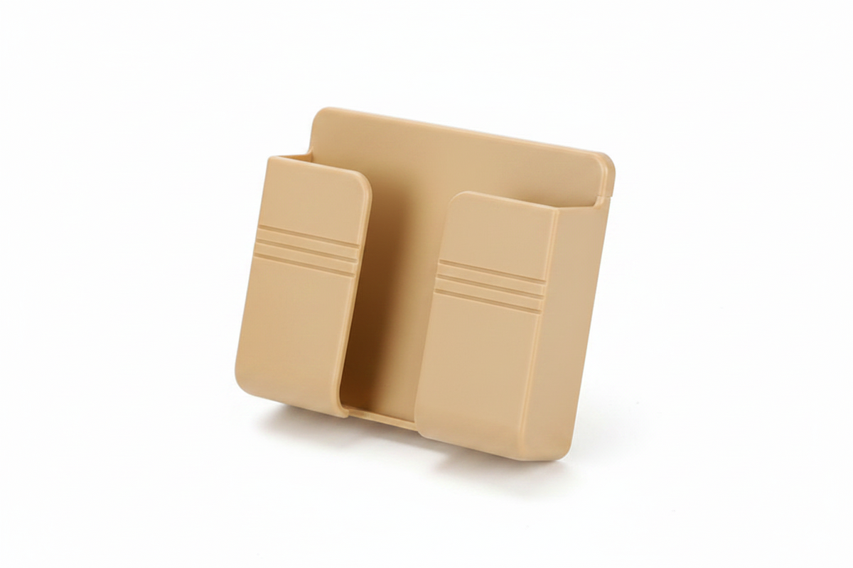A tan plastic phone holder shown on a clean white background.